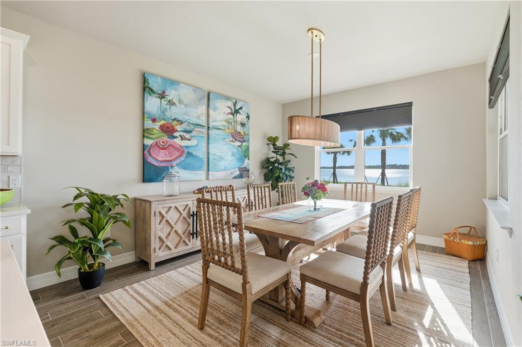 Recessed lighting, wood-finish flooring, and a large window with direct water frontage
