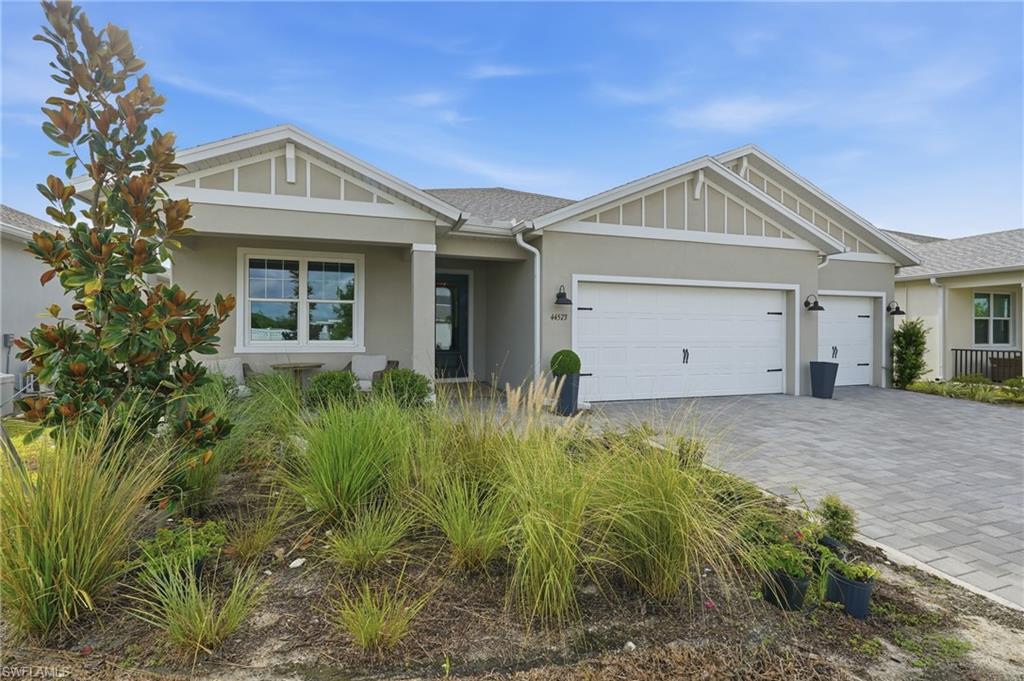 Contemporary exterior with a stucco finish and gabled rooflines