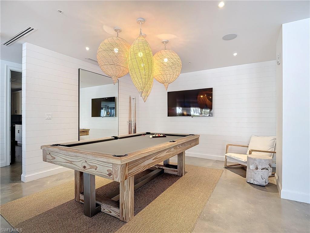 Rec room with pool table and concrete flooring