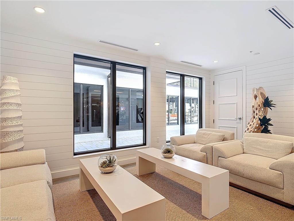 Living room featuring wood walls