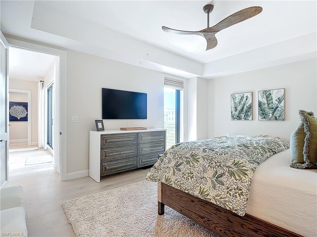 Bedroom with light hardwood / wood-style flooring and ceiling fan