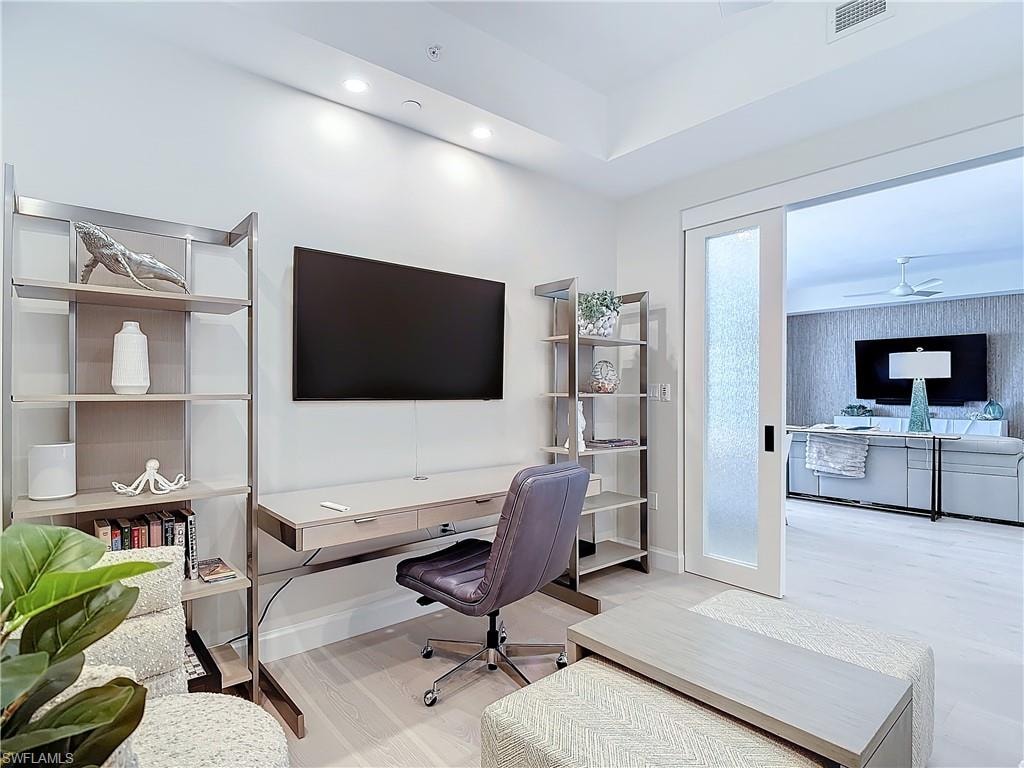 Office featuring light wood-type flooring and ceiling fan