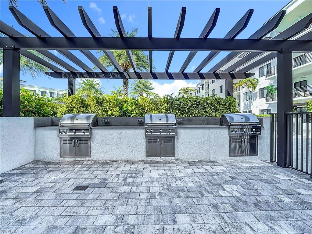 View of patio / terrace featuring a pergola, area for grilling, and exterior kitchen