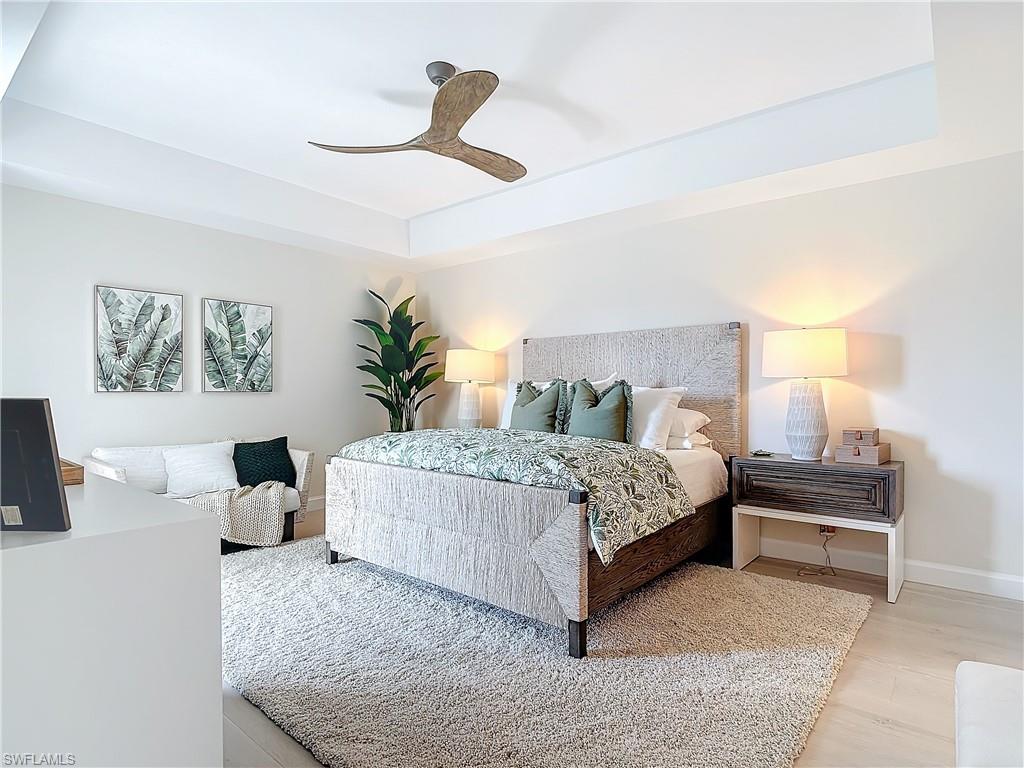 Bedroom featuring light hardwood / wood-style floors and ceiling fan