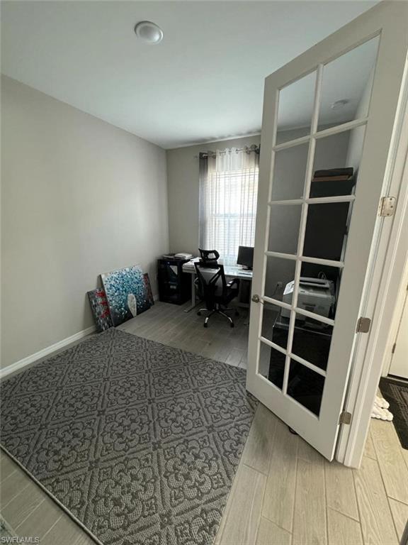 Home office featuring hardwood / wood-style floors