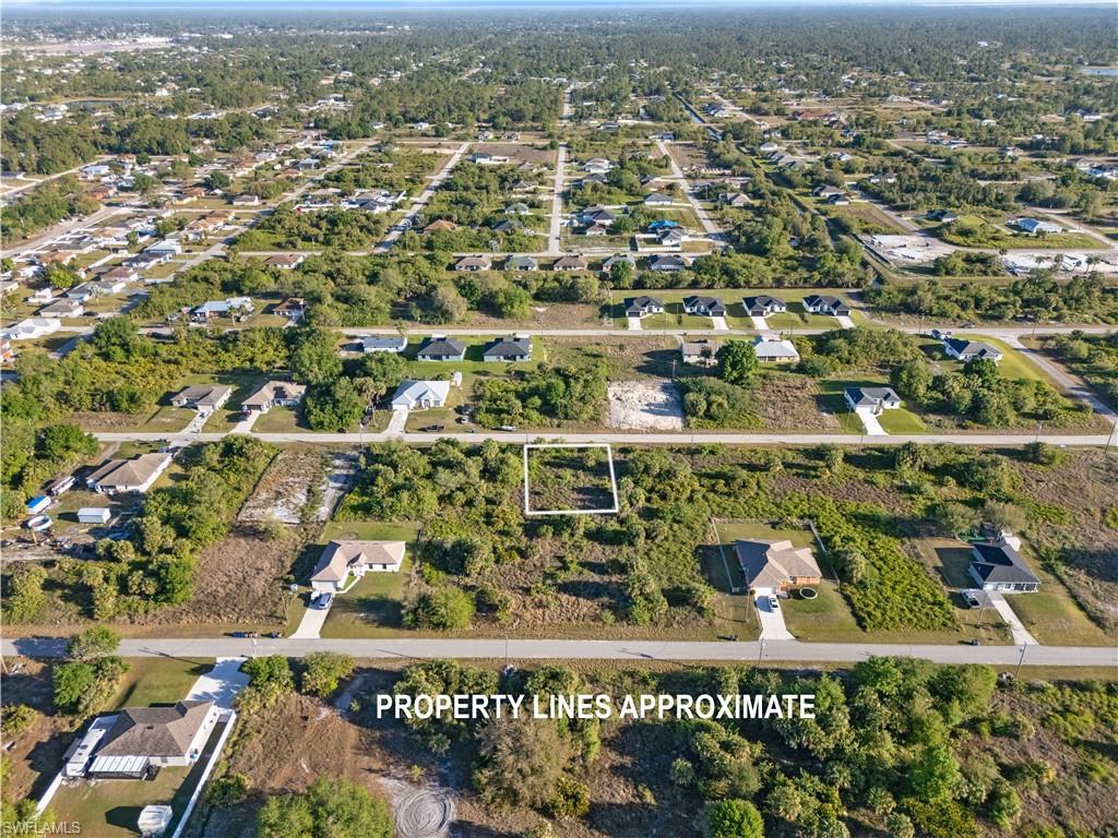 Vacant land parcel featuring a rectangular shape and surrounding residential properties