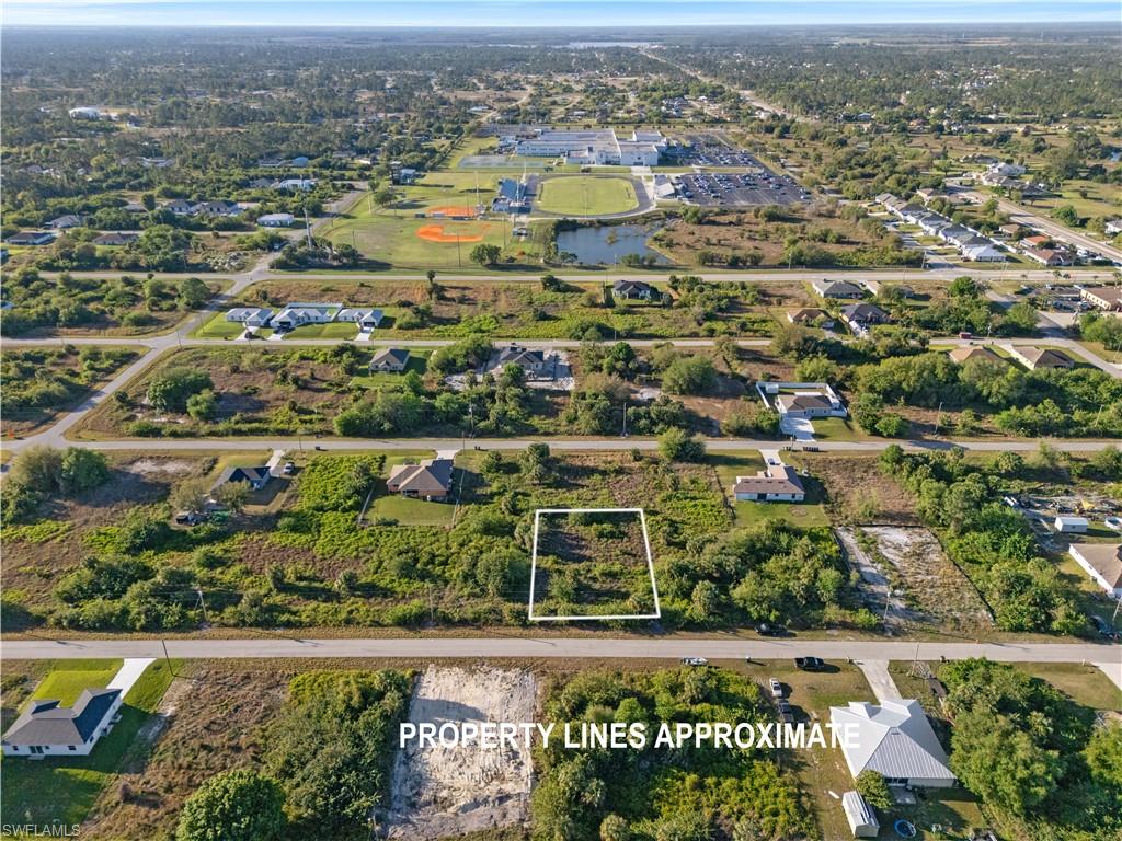 Expansive undeveloped parcel featuring established foliage and street frontage