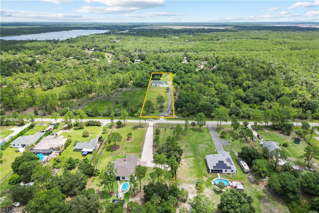 Expansive acreage with a single-story residence and private driveway