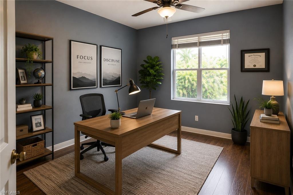 Room featuring wood-finish flooring, a ceiling fan with integrated lighting, and a large window with horizontal blinds