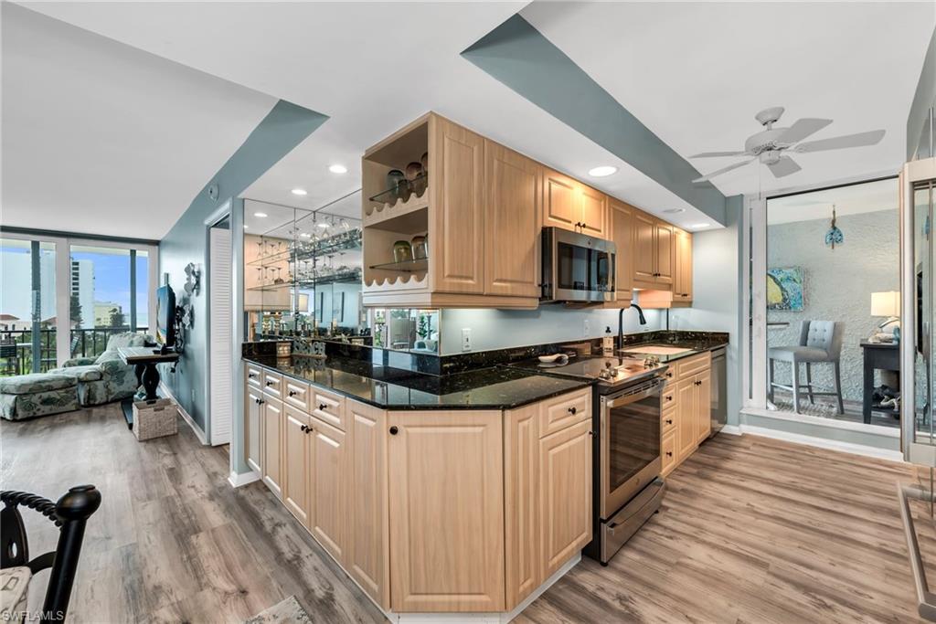 Well-equipped kitchen featuring ample cabinetry and generous workspace.