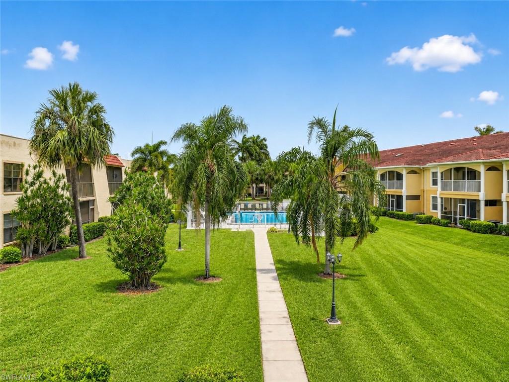 Expansive green space with a central paved pathway