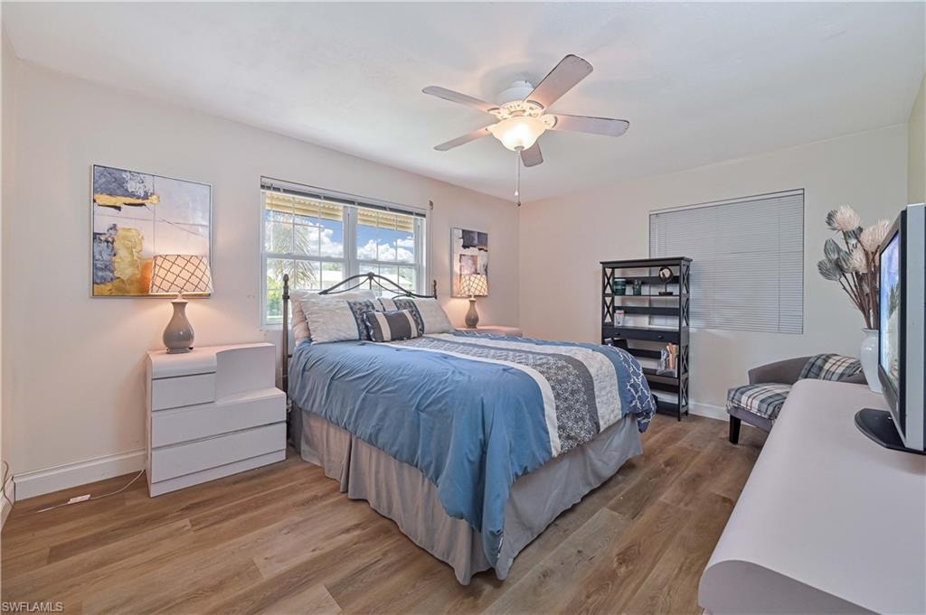 Warm wood-finish flooring complements the neutral wall color