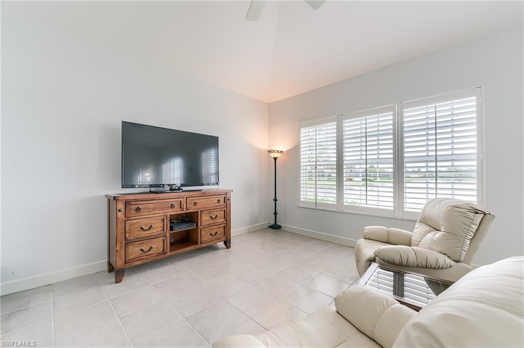Family room adjacent to the kitchen can accommodate a huge wall-mount TV