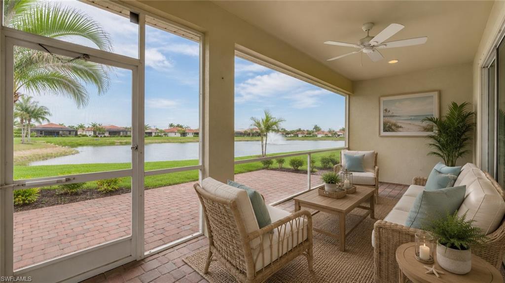 Virtual Screened lanai featuring a brick paver patio, a ceiling fan, and direct water frontage with a fountain feature