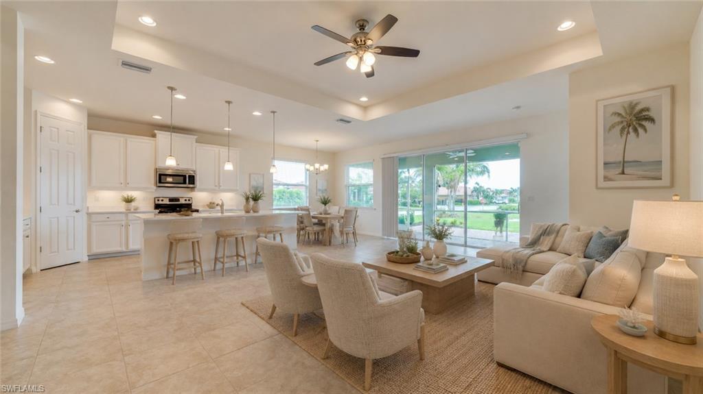 Virtual Open concept living area with tiled flooring throughout