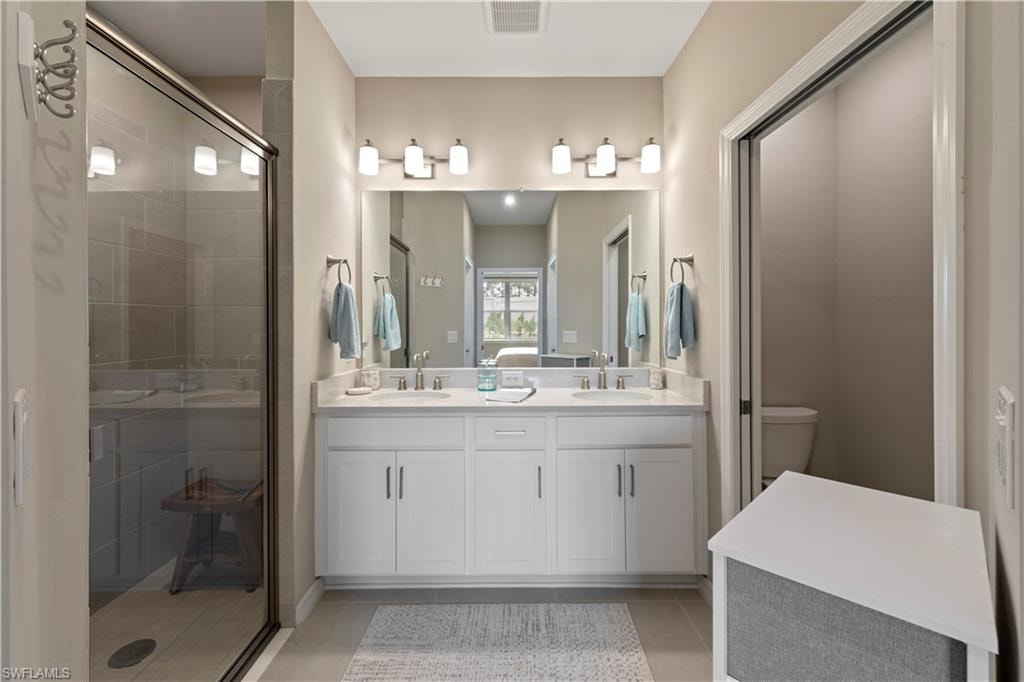 Spacious bathroom featuring a tiled, walk-in shower.