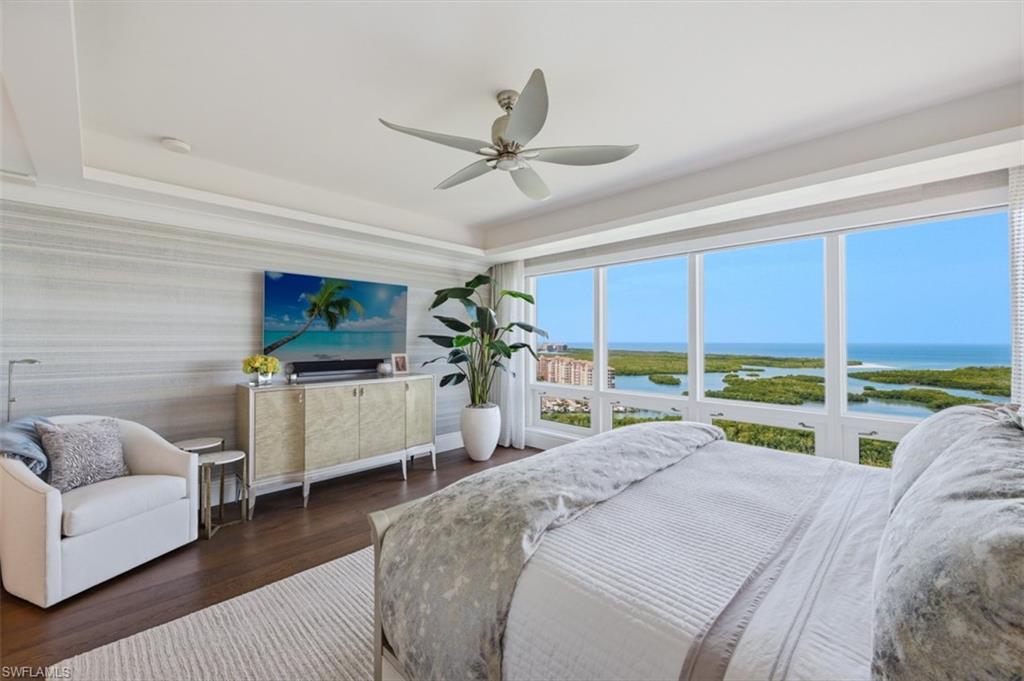 Panoramic coastal and mangrove scenery visible through expansive windows