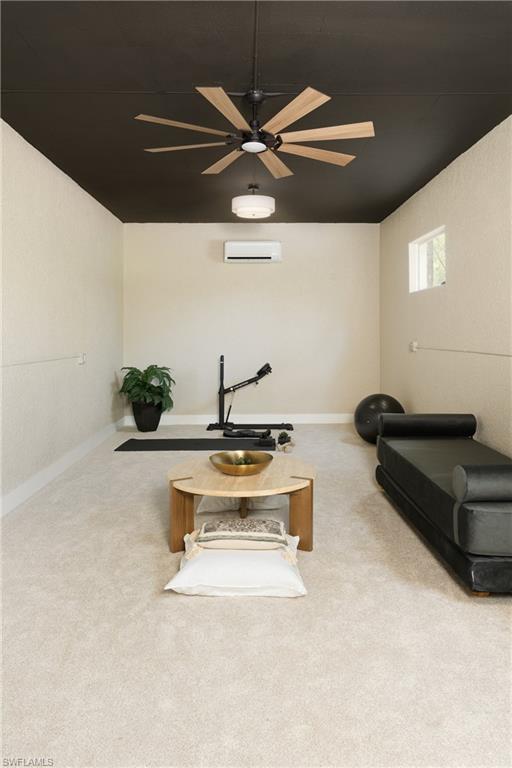 Spacious room featuring light-colored carpeting and a contrasting dark ceiling