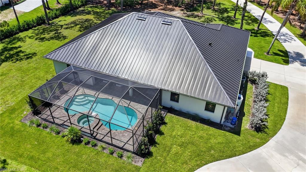 Screened pool and spa with paver decking