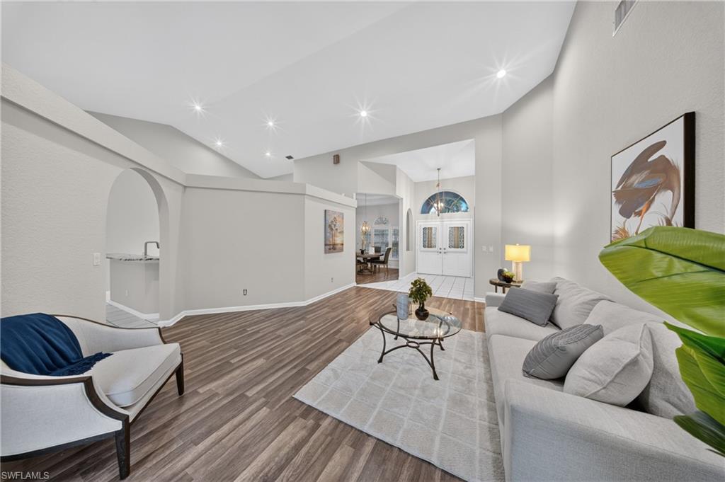 Volume ceilings and an open, light-filled floor plan throughout the main living area.
