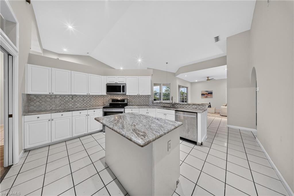 Bright open kitchen: granite counters, stainless appliances (new microwave & dishwasher), center island, and pull-outs in every lower cabinet.Bright open kitchen: granite counters, stainless appliances (new microwave & dishwasher), center island, and pull-outs in every lower cabinet.