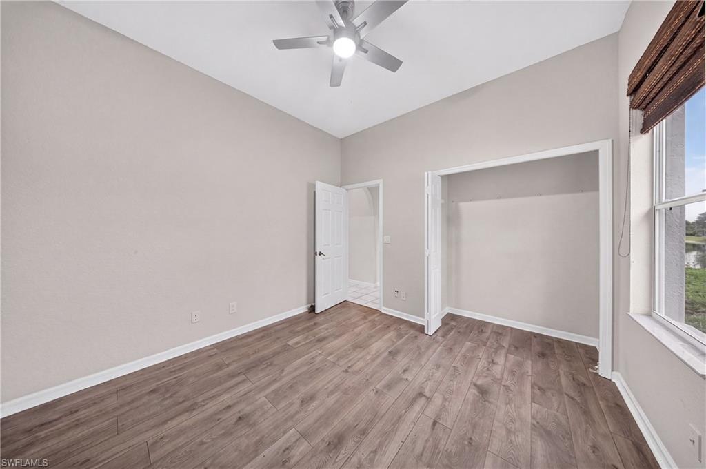 Generous secondary bedroom with new flooring and ample closet.