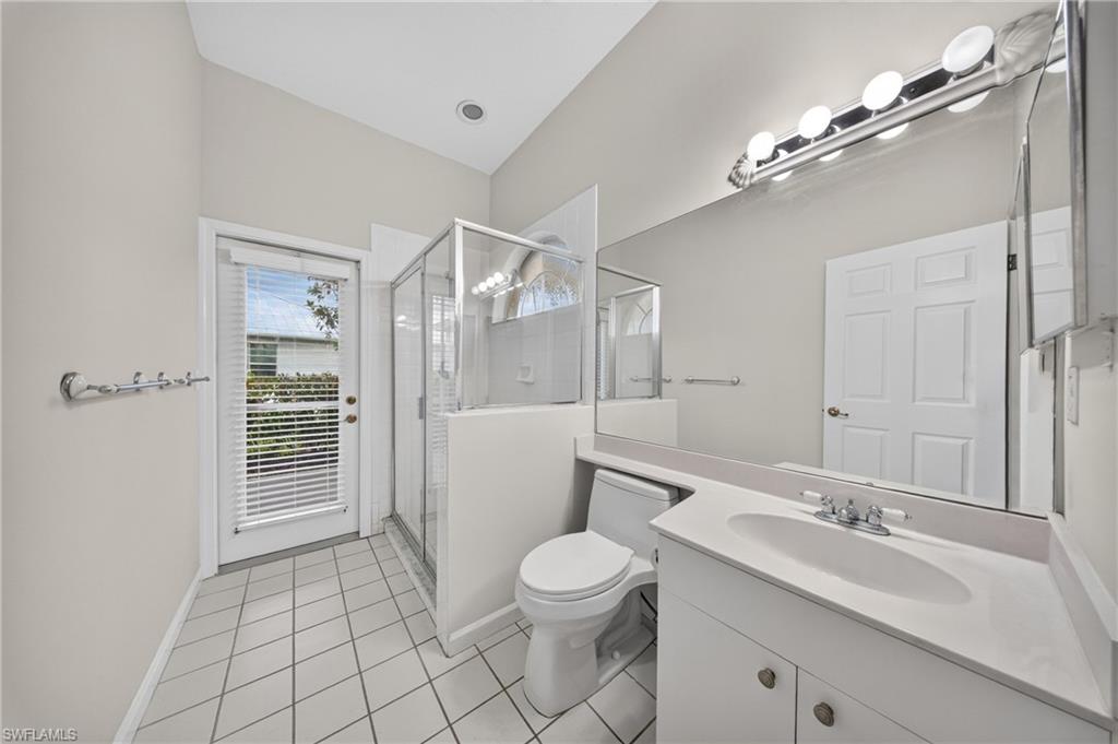 Third full bath with walk-in shower and convenient lanai access.