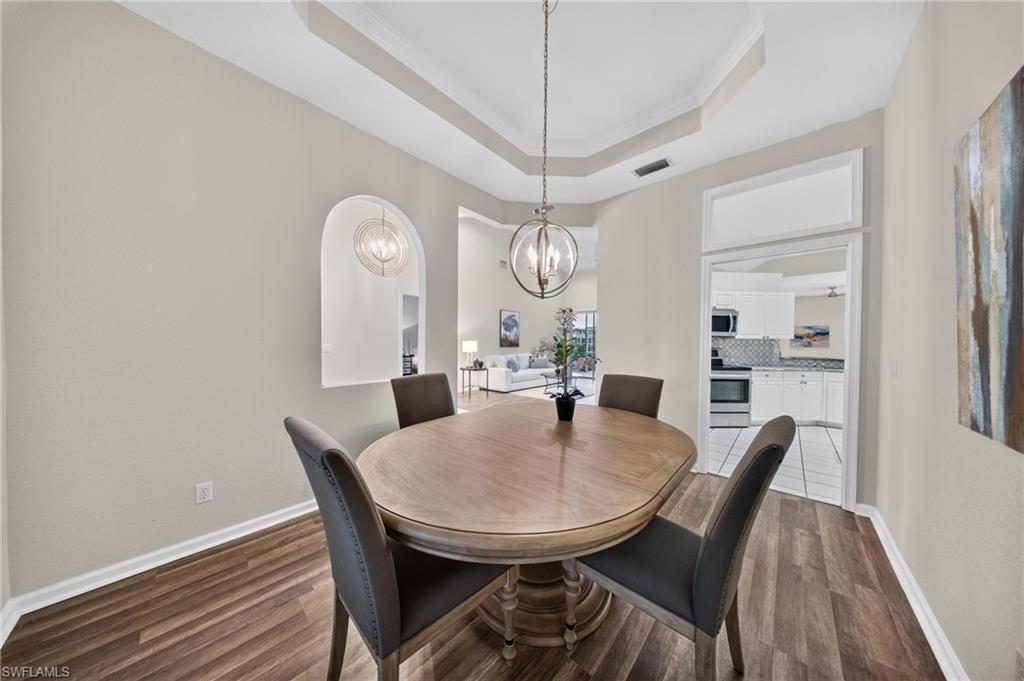Open sightlines connect the dining room to the kitchen and great room.