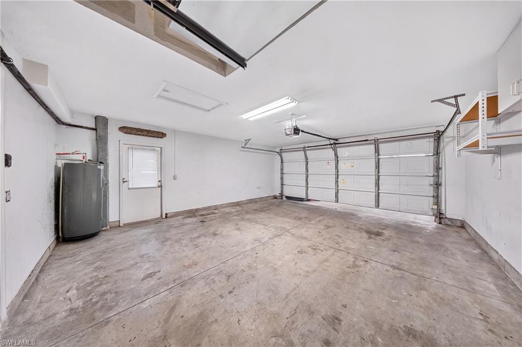 Clean, spacious 2-car garage with room for storage and a workshop.