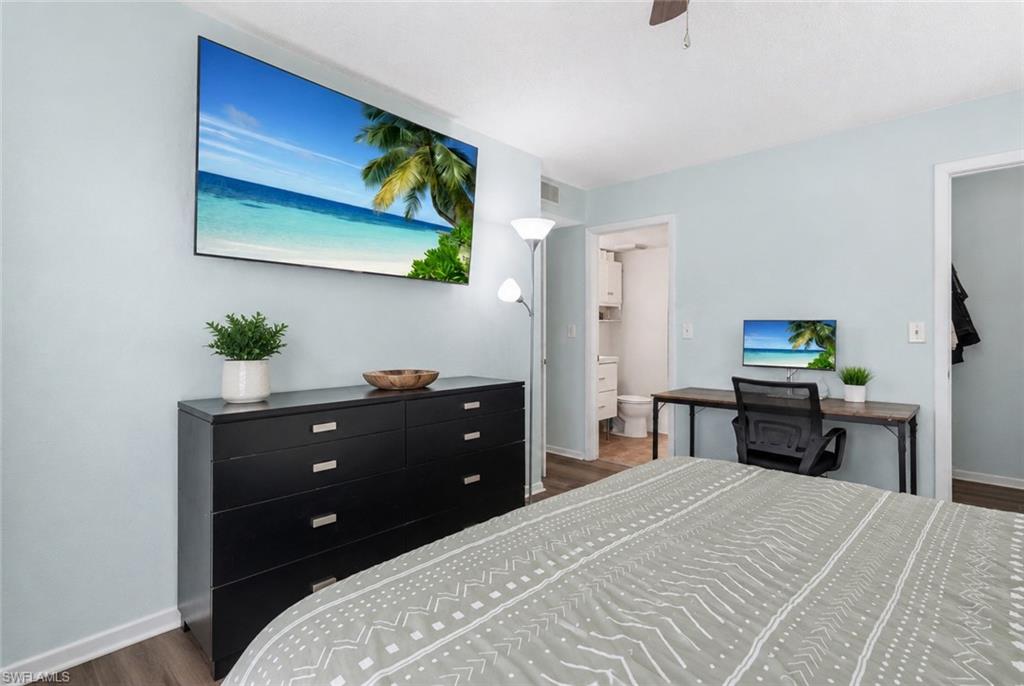 Light blue painted walls with wood-finish flooring