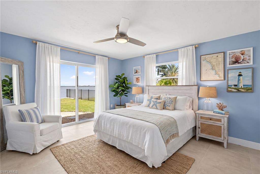 Bedroom #2 featuring sliding glass doors opening to a waterfront expanse