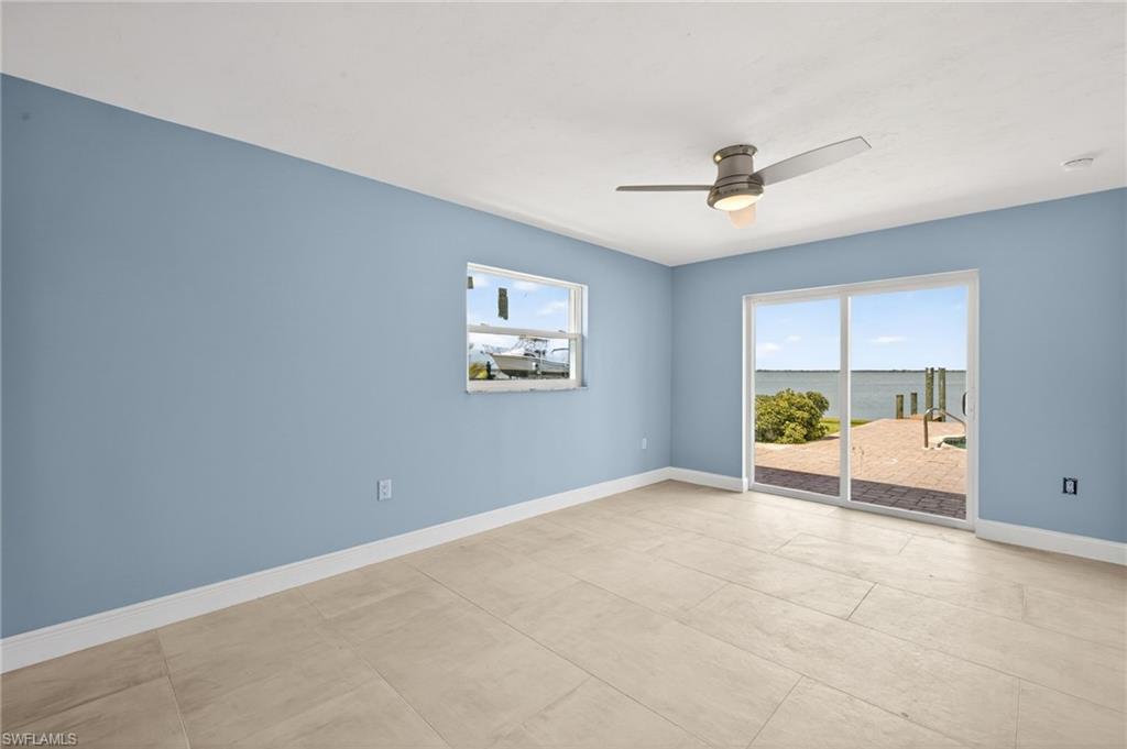 Light-toned tile flooring complements the soft blue walls