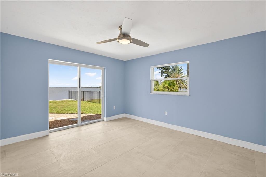 Bedroom #2 featuring light blue walls, ceramic tile flooring, and a contemporary ceiling fan