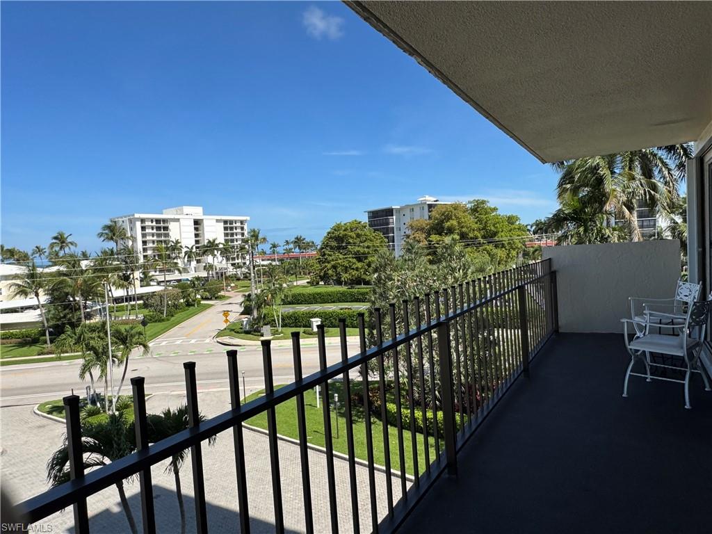 Long balcony has plenty of room for sitting and enjoying Naples' famous sunsets. It also has a storage closet.