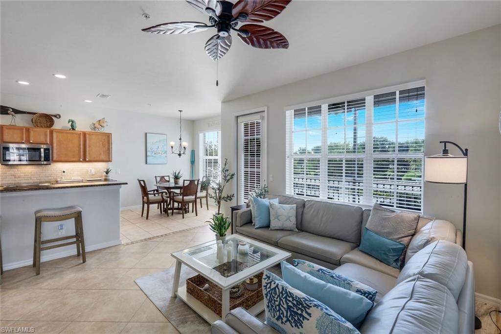 Open-concept living area with tile flooring throughout