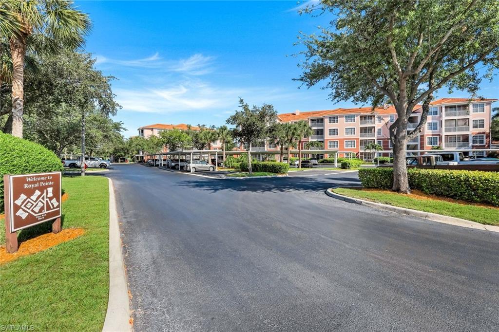 Residential community featuring multi-story buildings with terracotta-style roofs and private balconies