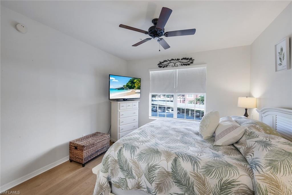 Bedroom featuring light wood-finish flooring and a ceiling fan