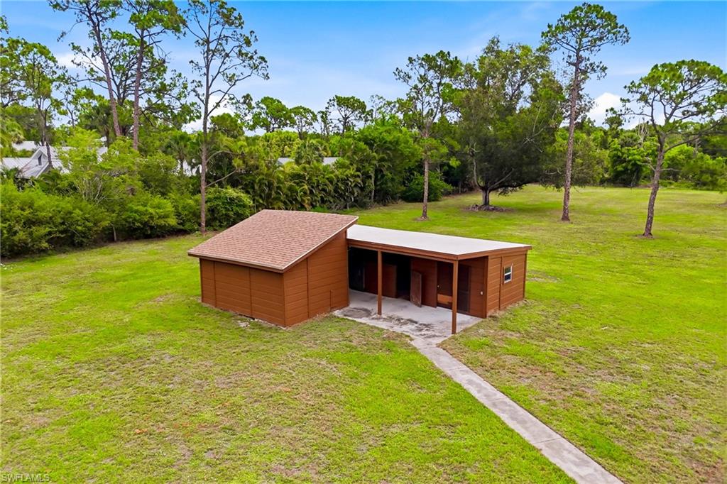 Stable with 2-stall horse barn complete with a tack room, storage room, and a dedicated livestock area.