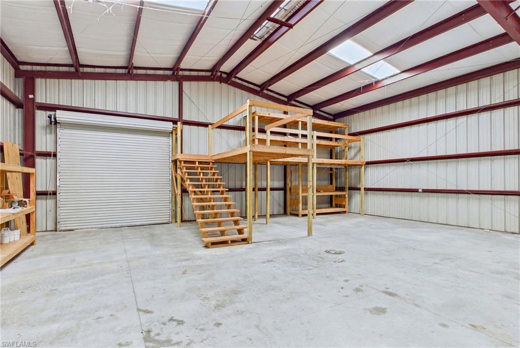 Inside view of 40' x 50' red steel building—ideal for RVs, equipment, vehicles, and much more.