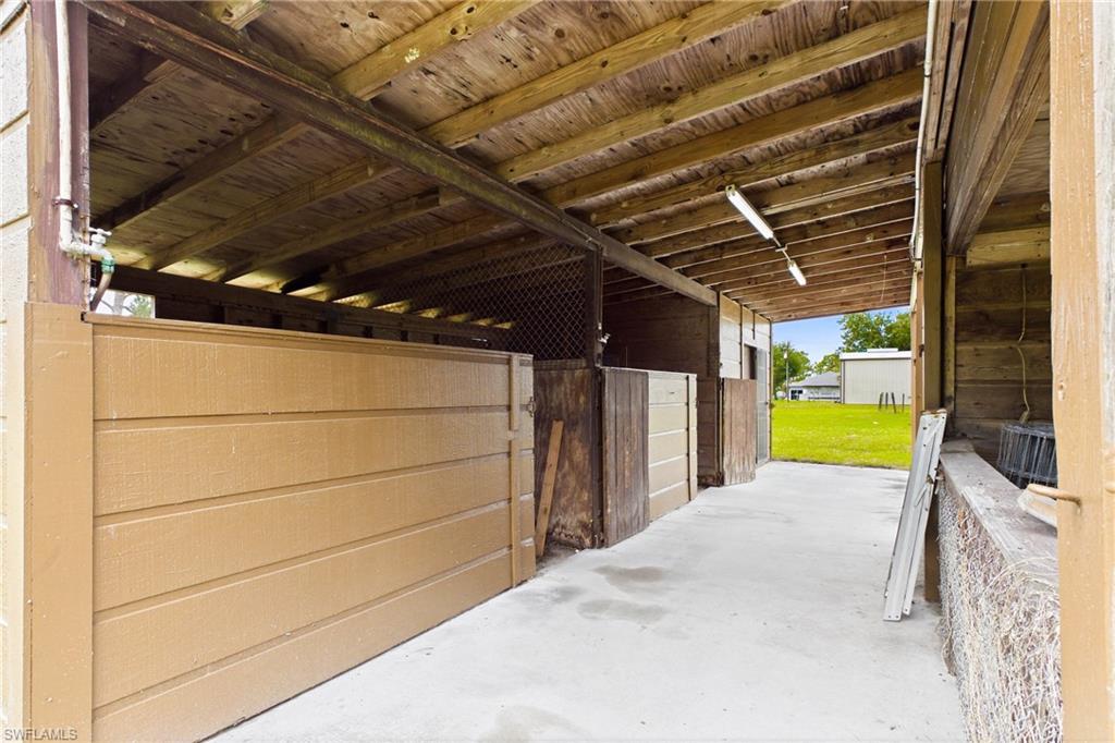 Stable with 2-stall horse barn complete with a tack room, storage room, and a dedicated livestock area.