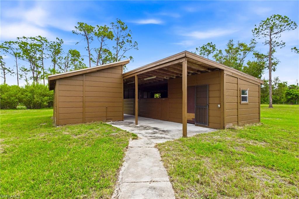 Stable with 2-stall horse barn complete with a tack room, storage room, and a dedicated livestock area.