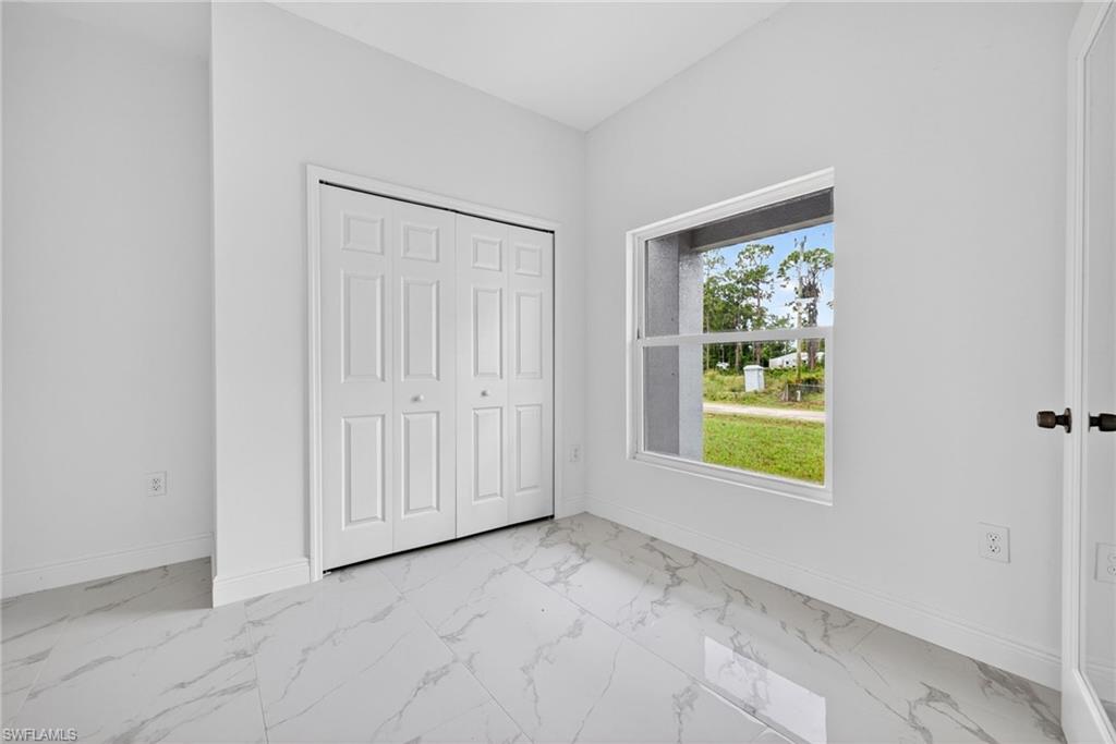Cozy den or home office featuring a stylish double-door entrance.