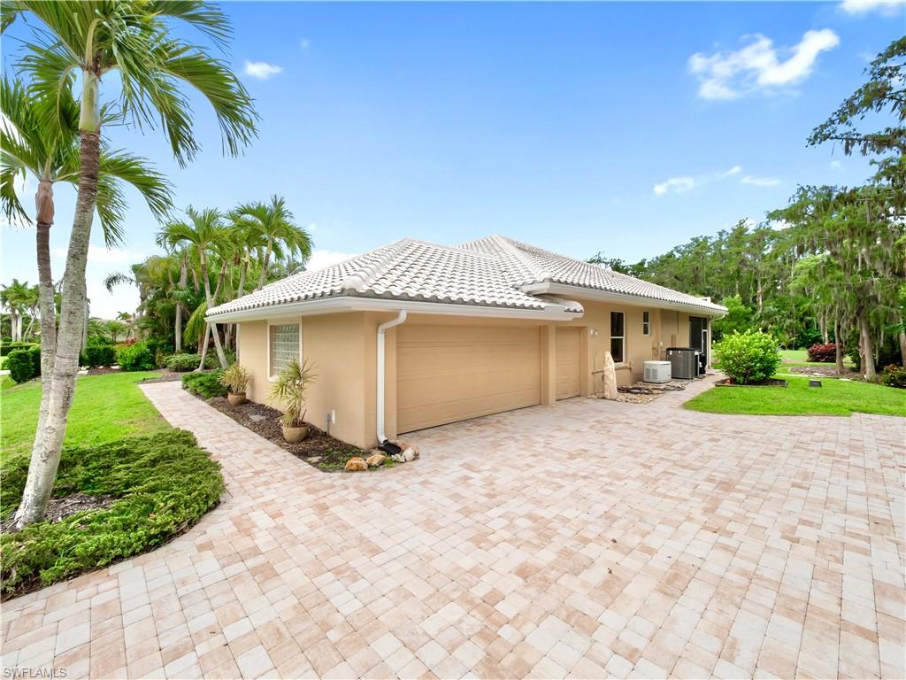 Large garage with golf cart access and generous storage space, a valuable feature for active country club living.