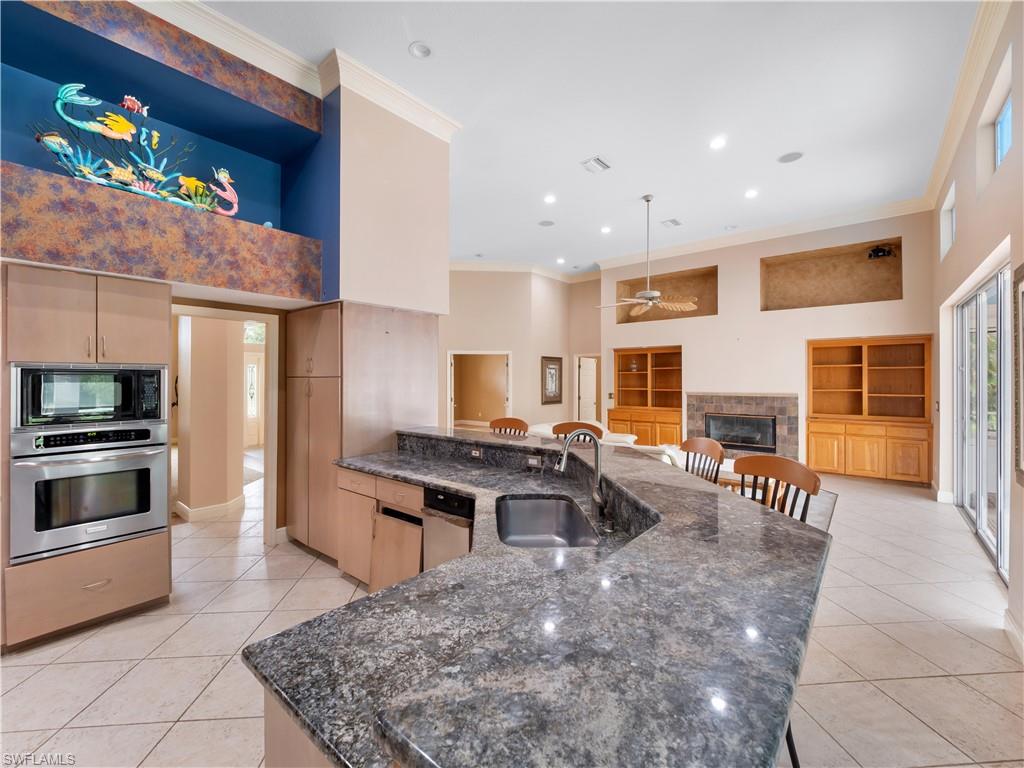 Generous kitchen and dining spaces provide the perfect foundation for a custom redesign, with soaring ceilings and a layout that naturally brings people together.