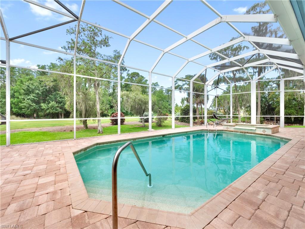 Enjoy poolside views of Hole 13 while surrounded by lush tropical landscaping, expansive green space, and a natural setting that feels more like a private retreat than a traditional golf course home.
