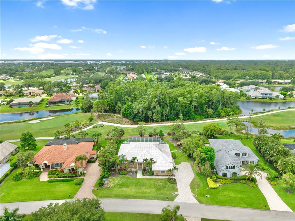 Aerial view showcasing the home's premium location overlooking the 13th hole of the renowned Loch Ness Golf Course, offering exceptional privacy, mature landscaping, and one of the most desirable golf course settings in Fiddlesticks Country Club.