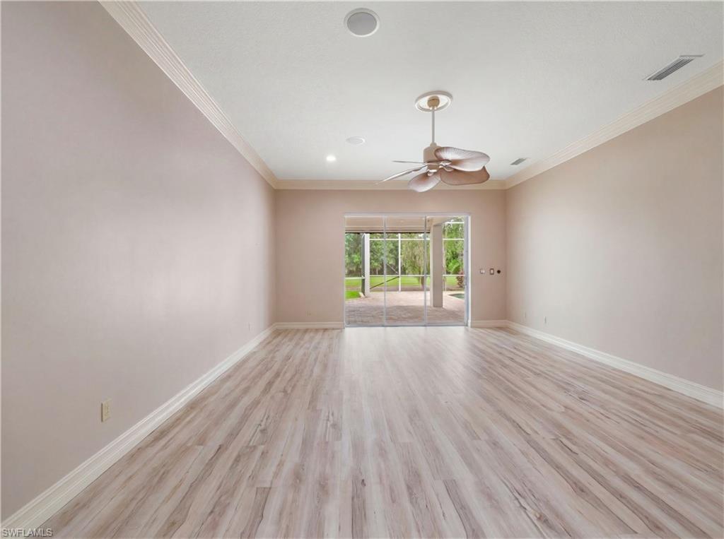 Designed as a private retreat, the primary bedroom offers exceptional space, natural light, and convenient access to the lanai and pool area.