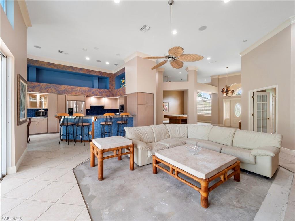 With approximately 13-foot ceilings and generous room dimensions, this living area provides the perfect foundation for a modern transformation.