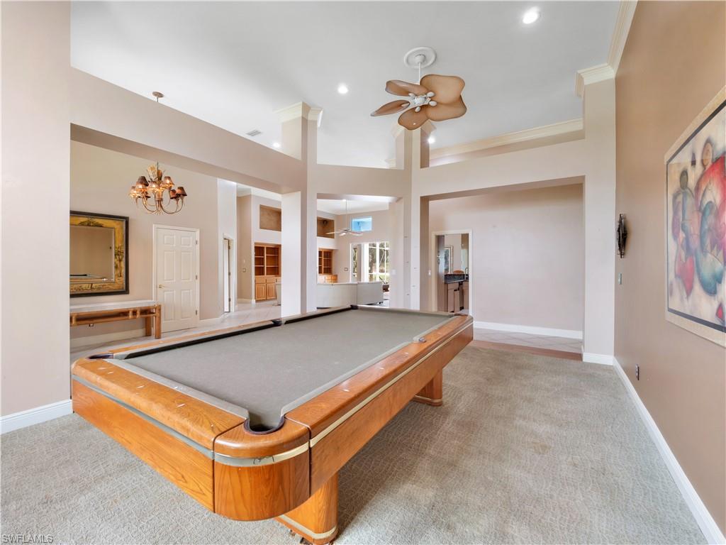 Designed for entertaining, this spacious room easily accommodates a pool table while offering the flexibility to serve as a formal dining room or multi-purpose living area.