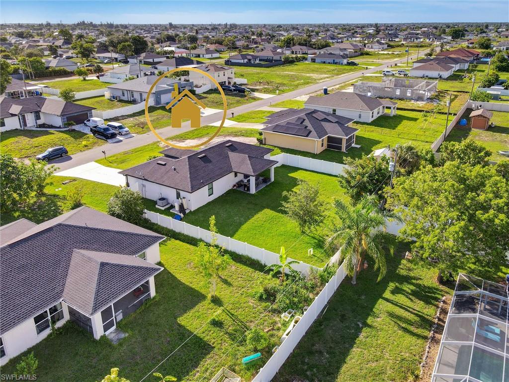 Aerial perspective showcasing a residential neighborhood with single-story homes